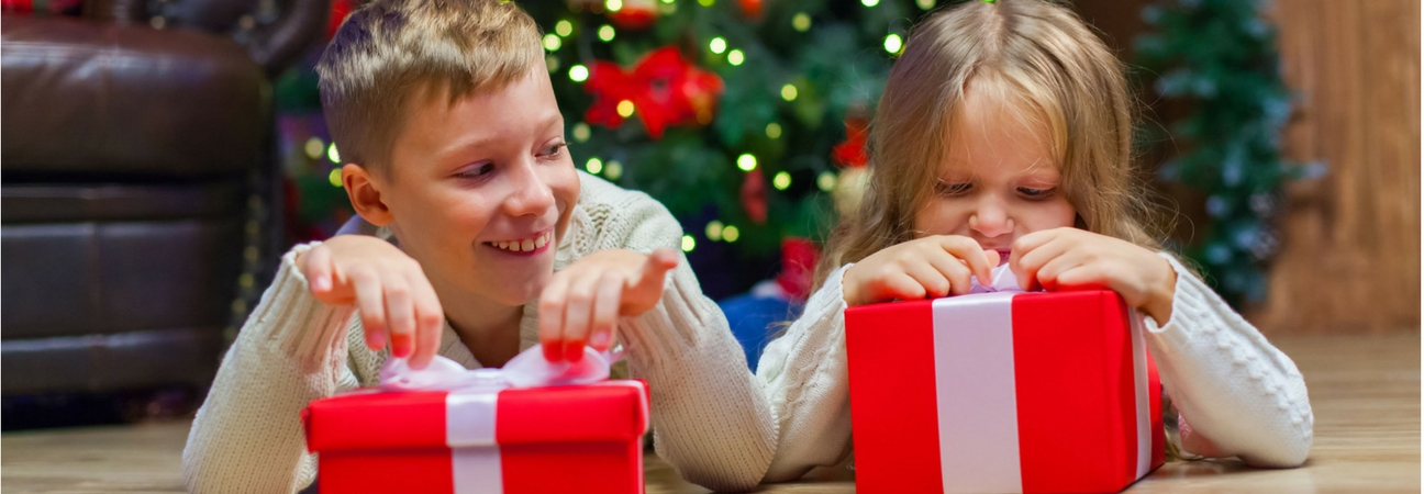 children opening presents on christmas morning