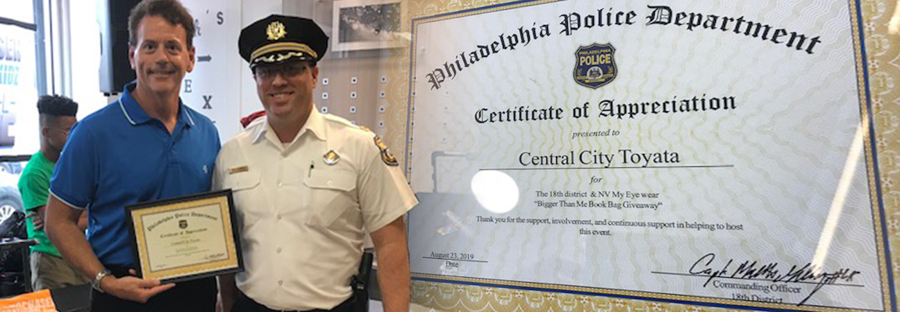 Central City Toyota GM Jamie Haberle accepts community service award