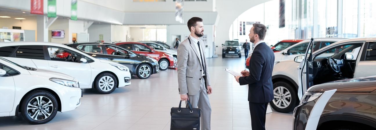 choosing a car to buy in a car dealership
