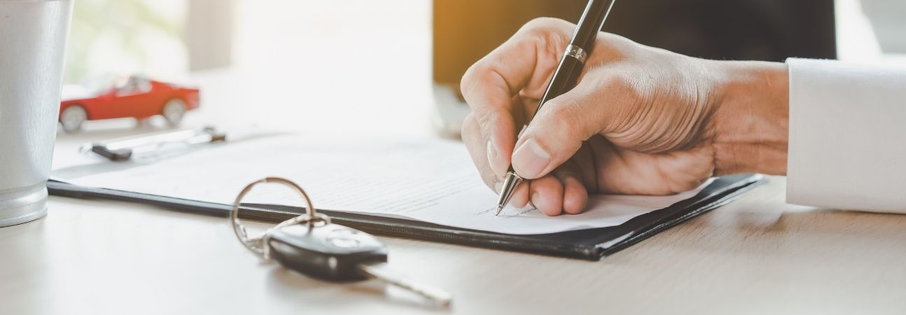 finance paperwork at a dealership